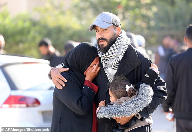 That came in response to repeated Israeli military attacks in the region - which is also considered the holy land in the Catholic faith. Pictured is a Palestinian father wearing the traditional pattern at al-Aqsa Hospital in Deir al Balah, Khan Younis, Gaza Strip, Palestinian Territories, on Thursday