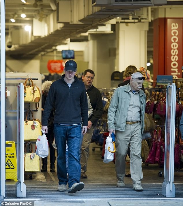 Prince Harry left TK Maxx on Kensington High Street with a shopping bag in 2013