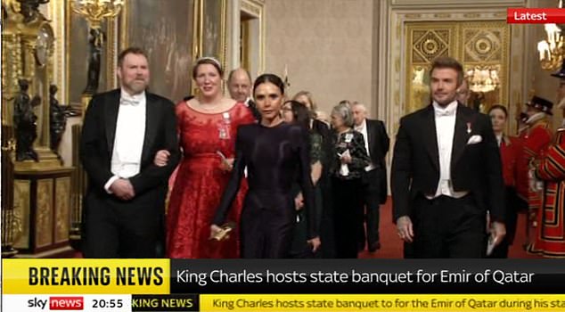 Proud David Beckham shook his wife Victoria's hand in reassurance on Tuesday evening as they joined the royals at King's glittering state banquet in Qatar