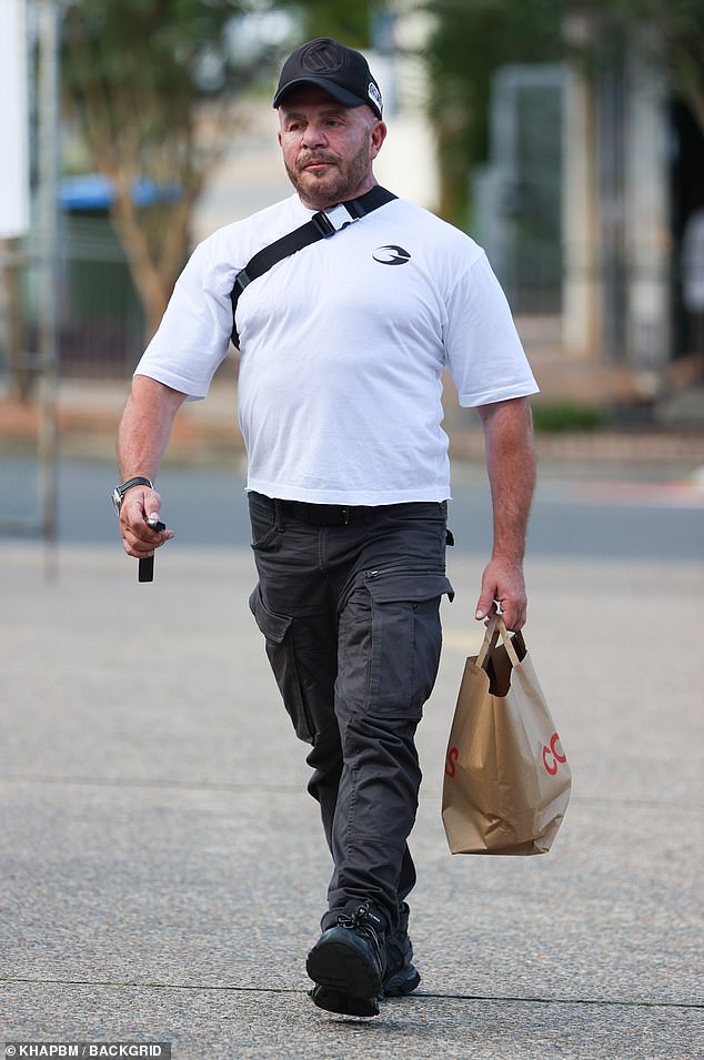 Fashion designer Alex Perry (pictured) looked almost unrecognizable on Monday as he was spotted on a trip to Coles in Sydney's west