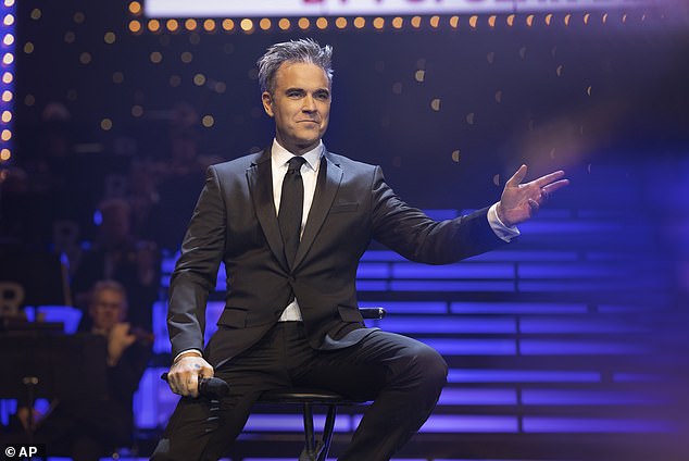 The semi-biographical film follows the singer's meteoric rise as a member of Take That and subsequent dramatic fall, as he battled his personal demons and the challenges that success can bring (depicted in film)