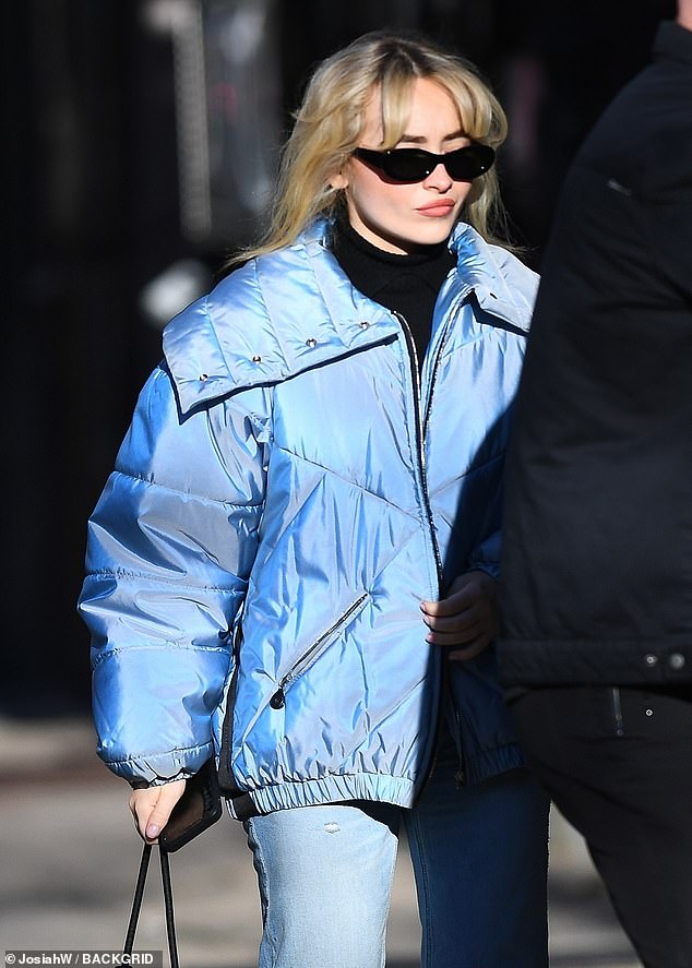 Sabrina Carpenter donned blue as she stepped out in chilly New York City on Thursday