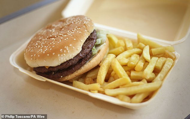 The above shows a burger, with scientists also warning that a cheeseburger can save up to nine minutes of a person's life