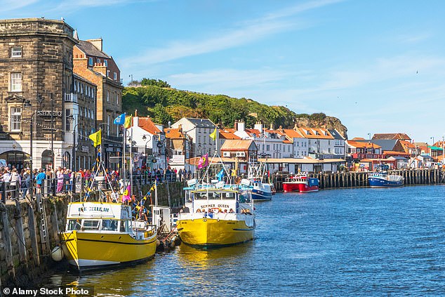 Whitby Harbor in North Yorkshire. Middle-aged and older people who live close to the sea are less likely to suffer age-related mental decline, scientists have found