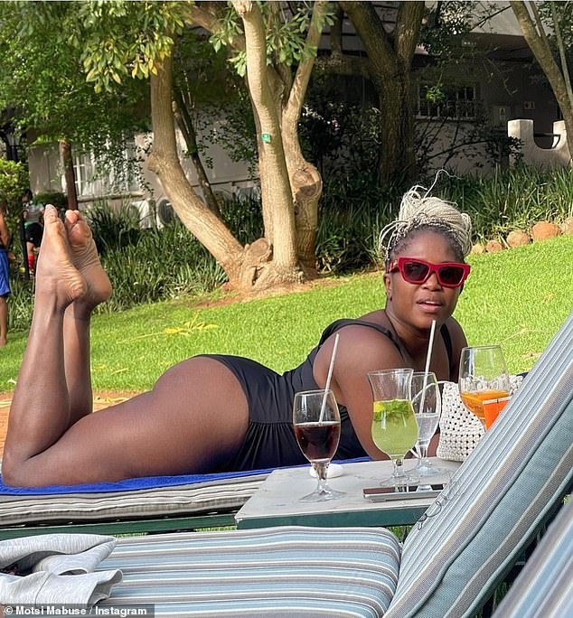 The Strictly judge, 43, showed off her sculpted backside as she relaxed on a lounger in South Africa, donning a pair of stylish red-rimmed sunglasses