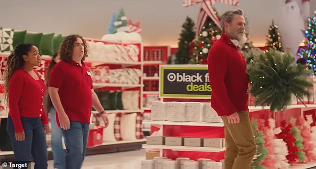 Another ad shows the handsome Santa Claus curling a Christmas tree with his biceps as he excitedly prepared for the Black Friday crowds