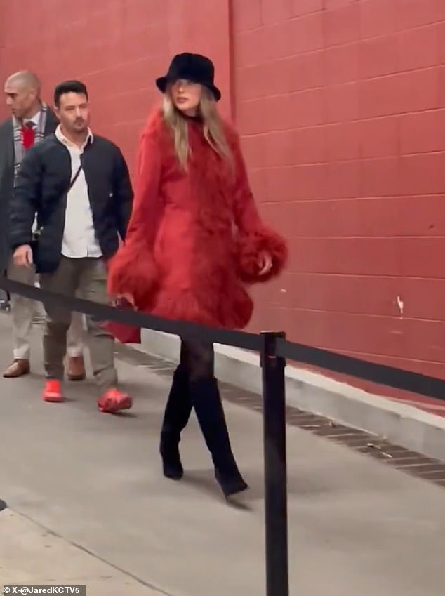 Swift wore a fluffy red jacket, black boots and a black fedora to watch the 13-1 Chiefs