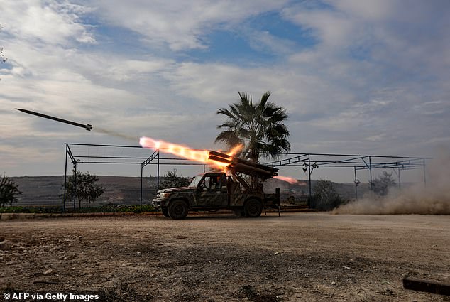 A multi-barrel rocket launcher fires at regime forces in the northern outskirts of the west-central city of Hama on December 4, 2024