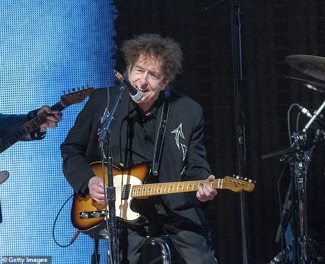 These days, the 83-year-old legend shows off his natural, effortlessly tousled brunette locks; Bob Dylan seen in September 2023