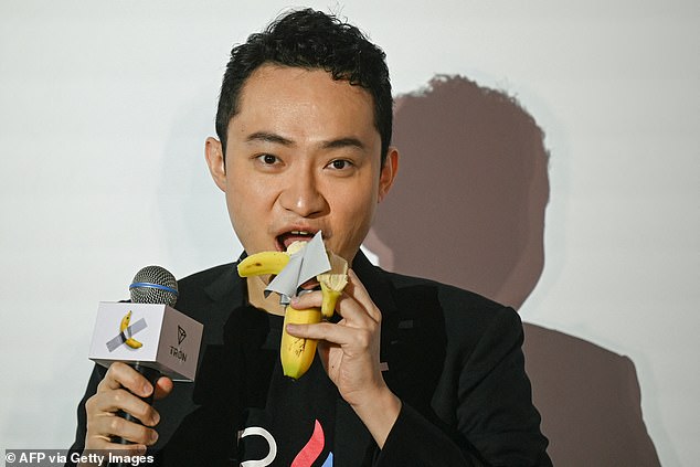 Chinese-born crypto founder Justin Sun is pictured Friday eating the banana that was part of the $6.2 million art installation he bought. Last week, he also invested $30 million in World Liberty Financial, a crypto company that directly benefits President-elect Donald Trump