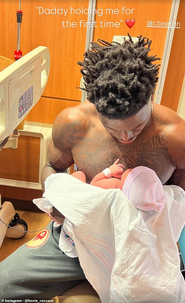 Tyreek Hill holds his new baby at the hospital in a photo posted by his wife Keeta Vaccaro