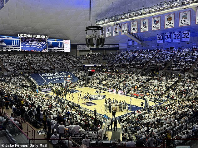 The scene at the Gampel Pavilion before the game between the UConn Huskies and the Baylor Bears. Pictured: A blue tifo with the text 'Basketball Capital of the World' within the outline of the state.