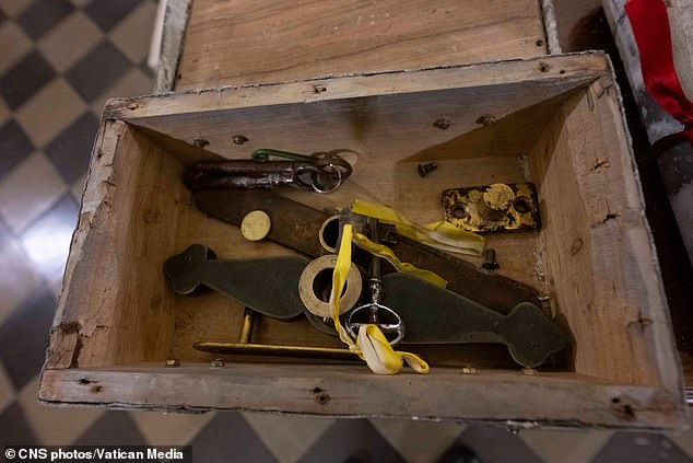 The Catholic Church began the ritual on December 2, praying at the door of St. Peter's Basilica and removing a metal box (pictured) containing a key, followed by ceremonies at the other four doors.