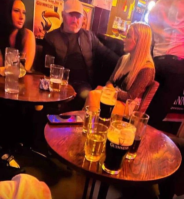 Rooney was seen sitting with a group of women during a night out at a pub