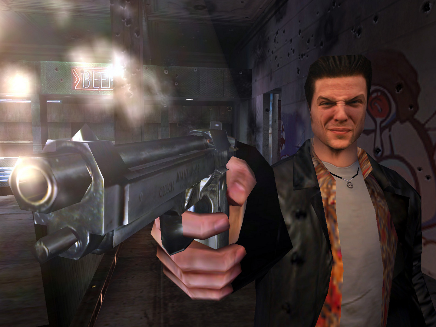 A screenshot of Max Payne from the first game. He points a gun at the viewer