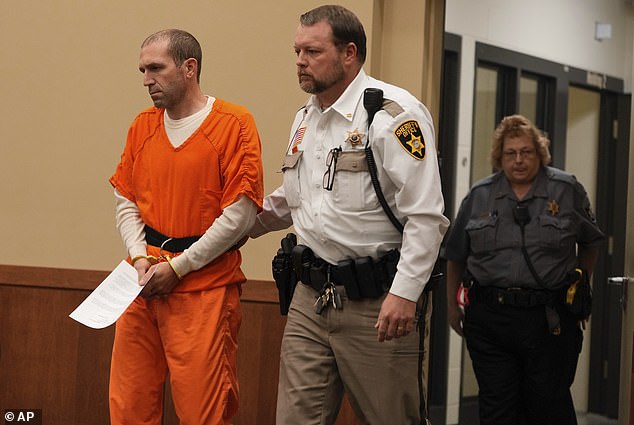 Married Wisconsin father Ryan Borgwardt, who tried to fake his own death in a kayaking accident before fleeing abroad, shuffled into court in handcuffs after his dramatic return to the US