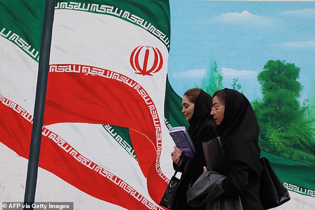 Two Iranian women in November. Women in Iran now face the death penalty or years behind bars if they violate new morality laws