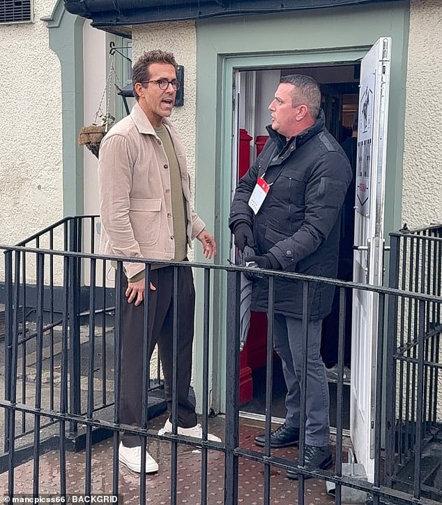 Hollywood stars Ryan Reynolds (seen) and Channing Tatum braved the stormy and wet weather in Wrexham as they left a local pub together in Wales on Saturday