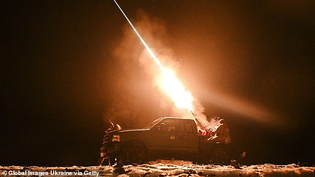 Ukrainian soldiers from the Mobile Air Defense Unit fire a machine gun at Russian drones during night patrol on December 2, 2024 in Chernihiv Oblast