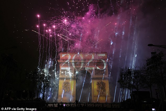 PARIS: Fireworks light up the sky around the L'Arc de Triomphe on the Avenue des Champs-Elysees in Paris early January 1, 2025