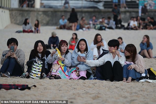 Many camped on Bondi Beach for hours before dawn