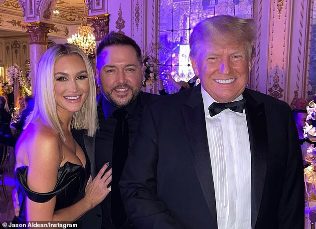 Country singer Jason Aldean (center) poses for a photo with former President Donald Trump (right) and his wife Brittany (left) on New Year's Eve at Mar-a-Lago in 2021. In 2022, Trump would announce his third run for president