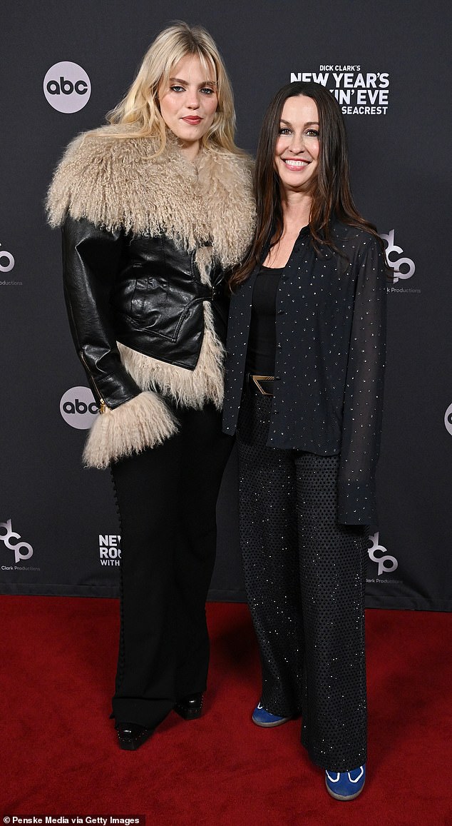 Alanis posed next to 24-year-old actress and singer Reneé Rapp