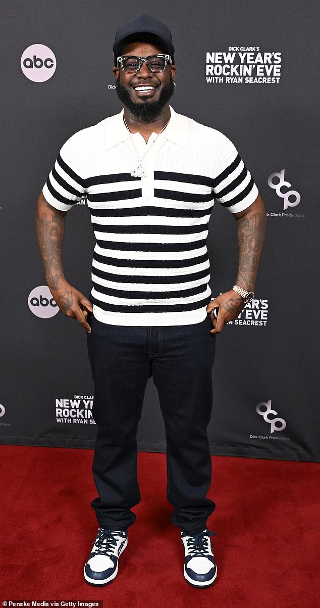 A slimmed-down T-Pain arrived in dark jeans and a horizontally striped black and white sweater