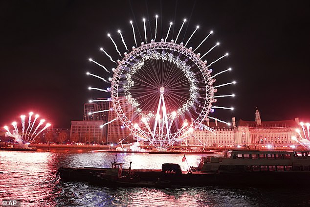 Fireworks light up the sky around the London Eye to celebrate the New Year in London