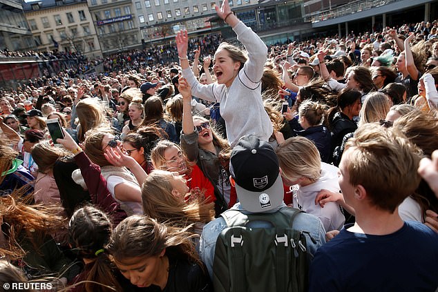 Avicii fans gather in central Stockholm to honor the Swedish DJ on April 21, 2018