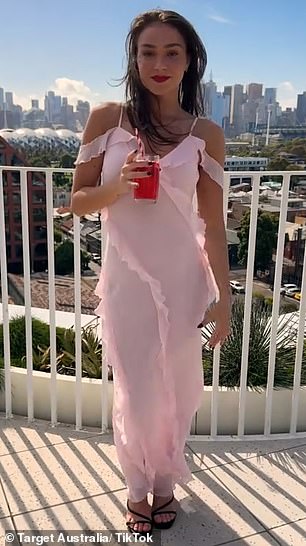 Target Australia shoppers are loving the stunning $70 pastel pink dress, which many say is the affordable alternative to designer label Aje's $495 style