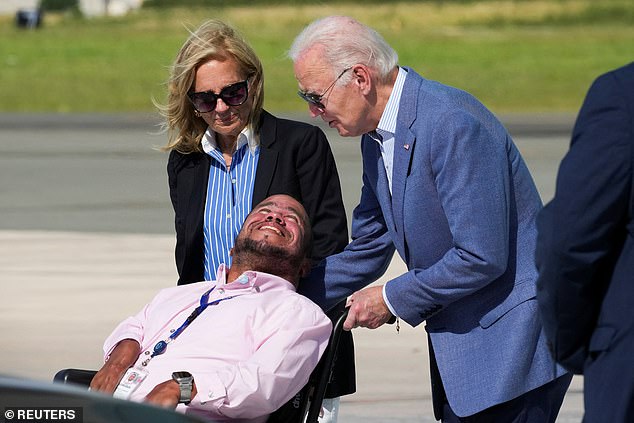 President Joe Biden and first lady Jill Biden speak with a man before boarding Air Force One