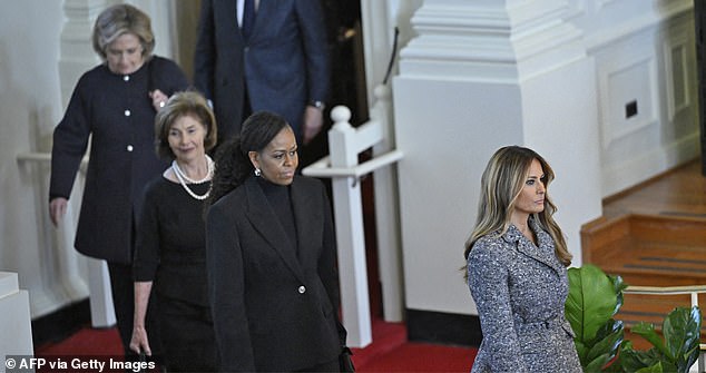 Former first ladies (from left) Hillary Clinton, Laura Bush, Michelle Obama and Melania Trump appeared together at the funeral service for Rosalynn Carter in November 2023 in Atlanta, Georgia. Jimmy Carter will have services in both Atlanta and Washington, DC