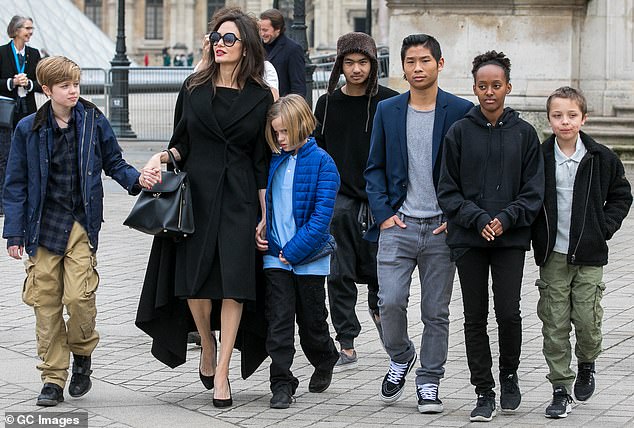 The former couple had three children — Shiloh, 18, and twins Knox and Vivienne, 16 — and also adopted Maddox, 23, Pax, 21, and Zahara, 19; Jolie pictured with all six children in 2018