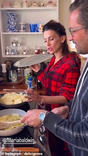 Video obtained by DailyMail.com showed Hilaria treating her holiday guests to 'traditional' Spanish tortilla