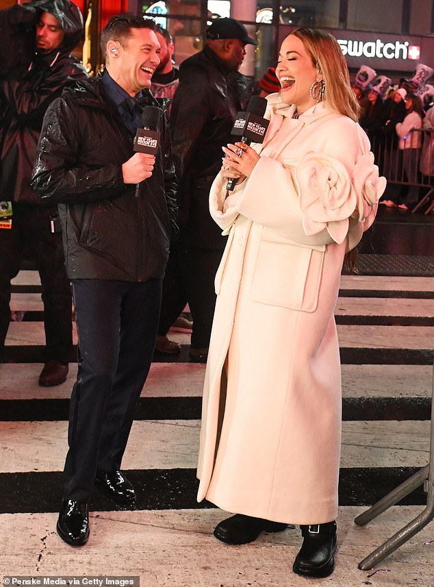 Ora further accessorized the third outfit with silver earrings and colorful rings on her left hand