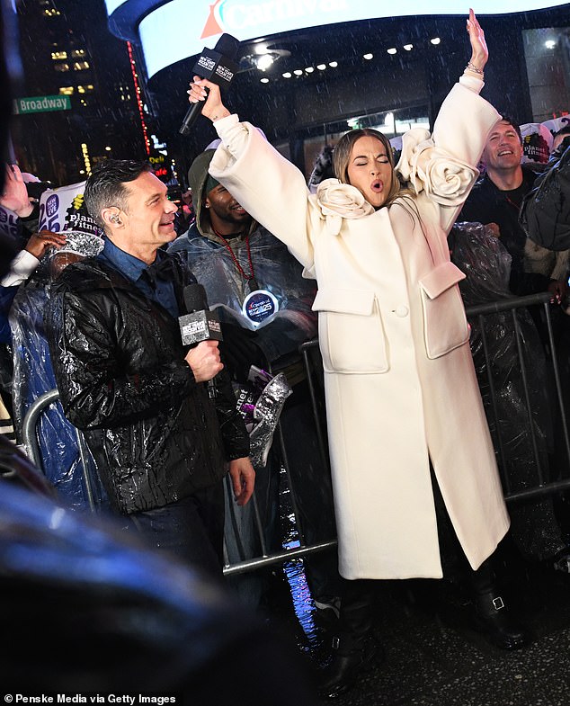 Ora was also seen throwing her arms in the air as the rain came down during the celebration