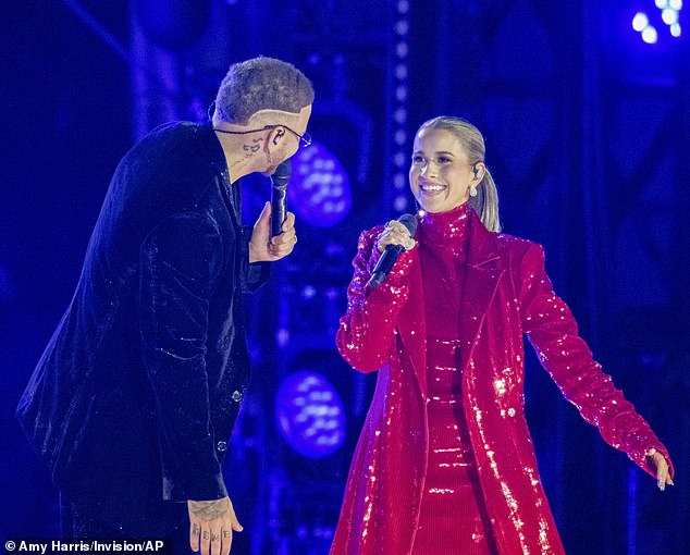 Katelyn dazzled in a red sequin dress and jacket, which contrasted with Kane's black ensemble