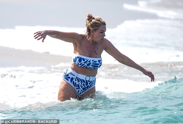 1735734049 622 Claire Sweeney risks wardrobe malfunction as her bikini top nearly