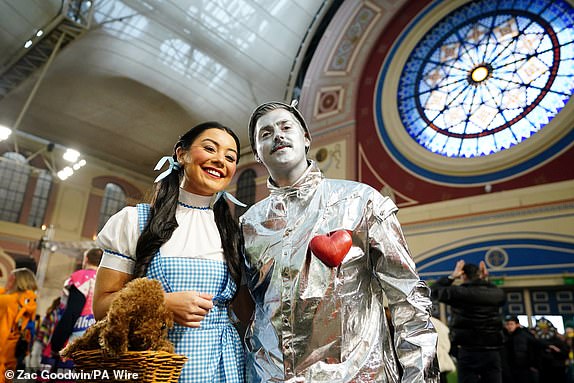 Fans dressed as characters from "The Wizard of Oz" during day fourteen of the Paddy Power World Darts Championship at Alexandra Palace, London. Date of photo: Wednesday January 1, 2025. PA Photo. See PA story DARTS World. Photo credit should read: Zac Goodwin/PA Wire. RESTRICTIONS: Use subject to restrictions. Editorial use only, no commercial use without prior permission from the rights holder.