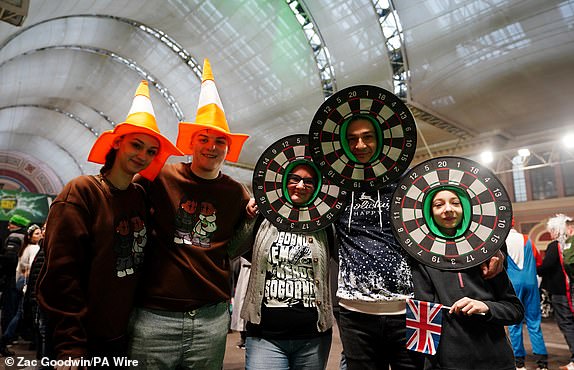 Fans in fancy dress during day fourteen of the Paddy Power World Darts Championship at Alexandra Palace, London. Date of photo: Wednesday January 1, 2025. PA Photo. See PA story DARTS World. Photo credit should read: Zac Goodwin/PA Wire. RESTRICTIONS: Use subject to restrictions. Editorial use only, no commercial use without prior permission from the rights holder.