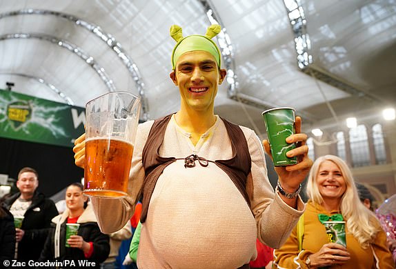 A fan dressed as "Shrek" during day fourteen of the Paddy Power World Darts Championship at Alexandra Palace, London. Date of photo: Wednesday January 1, 2025. PA Photo. See PA story DARTS World. Photo credit should read: Zac Goodwin/PA Wire. RESTRICTIONS: Use subject to restrictions. Editorial use only, no commercial use without prior permission from the rights holder.