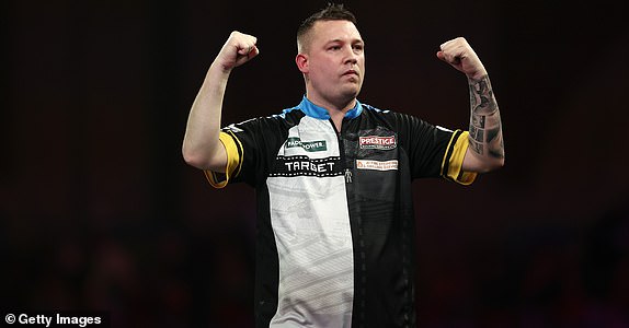 LONDON, ENGLAND – DECEMBER 30: Chris Dobey of England celebrates victory over Kevin Doets of the Netherlands after their fourth round match on day thirteen of the 2024/25 Paddy Power World Darts Championship at Alexandra Palace on December 30, 2024 in London, England . (Photo by James Fearn/Getty Images)