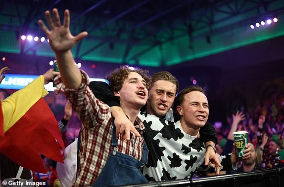 LONDON, ENGLAND - DECEMBER 29: Fans enjoy the match atmosphere during the third round match between England's Callan Rydz and Belgium's Dimitri Van den Bergh on day twelve of the 2024/25 Paddy Power World Darts Championship at Alexandra Palace on December 29, 2024 in London, England. (Photo by James Fearn/Getty Images)