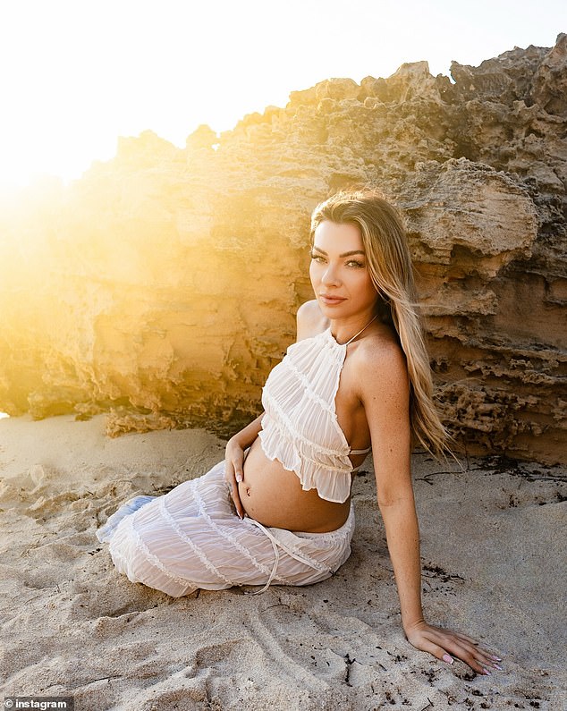 In the images, Leeson showed off her growing baby bump in a sheer white two-piece swimsuit as she posed for a photoshoot on the beach with McKeone