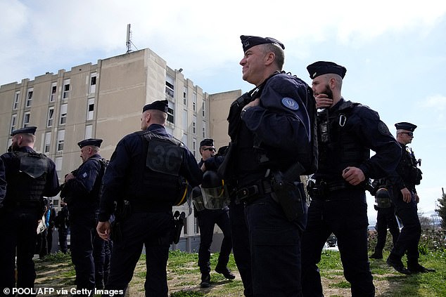 Police forces are in position during French President Emmanuel Macron's visit to Marseille last year, which focused on the fight against drug trafficking