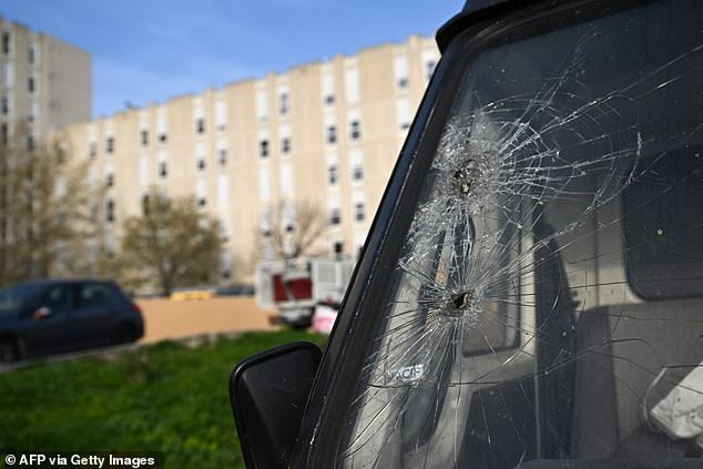 A photo taken on March 20, 2024, in the La Castellane district of Marseille, southern France, shows a bullet hit a police vehicle, a day after the visit of French President Emmanuel Macro