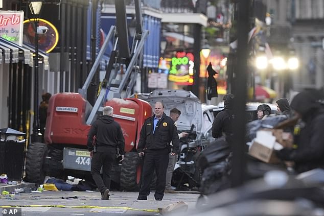 Security personnel investigate the scene on Bourbon Street after a vehicle drove into a crowd