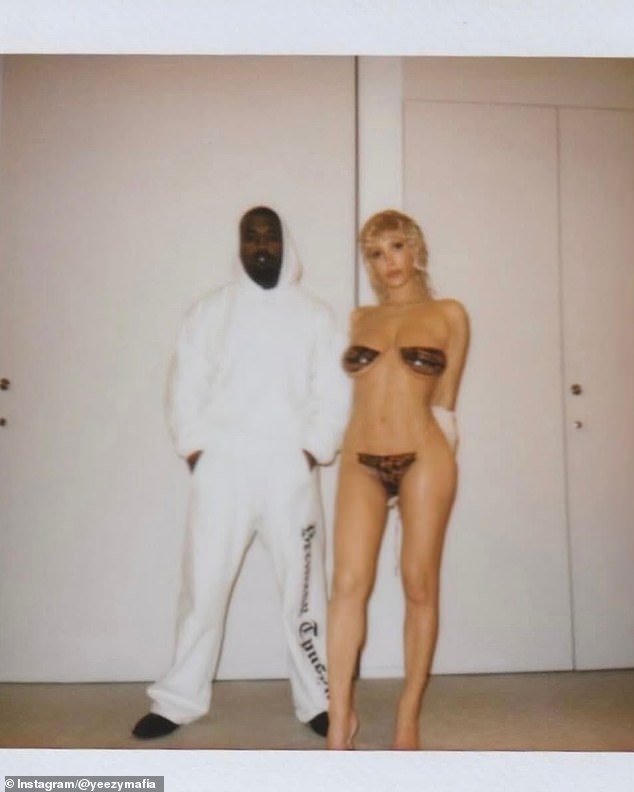 In another image, she also wore a barely there bikini - paired with blonde locks - as she posed with a fully clothed Kanye