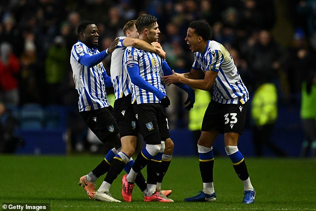 Windass was mobbed by his teammates after scoring an incredible goal, sending Sheffield Wednesday on their way to victory